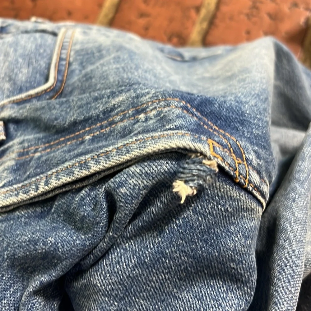 Re Done high rise stove pipe raw frayed hem denim jeans